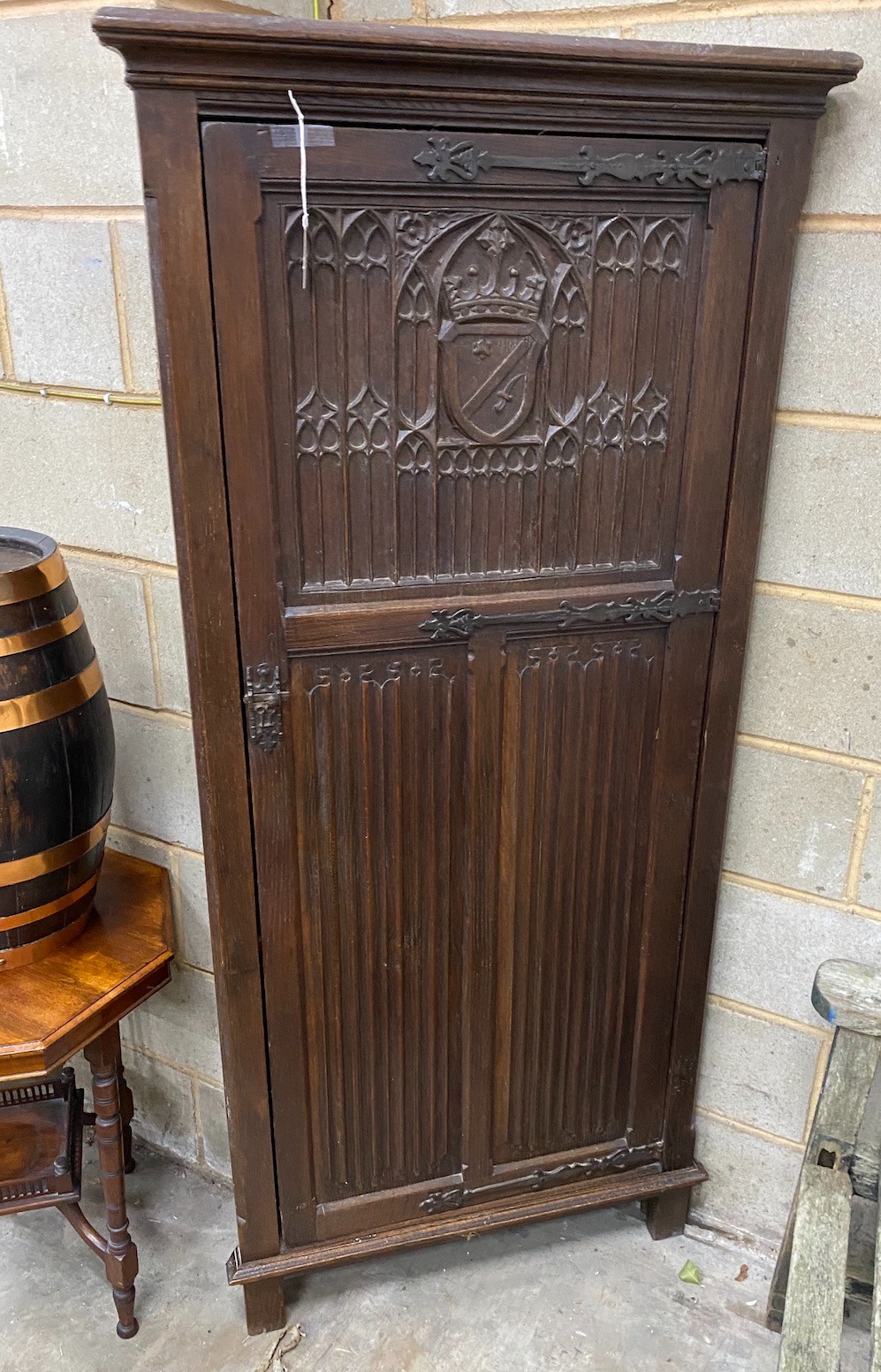 A 17th century style oak linenfold moulded standing corner cabinet, width 83cm, depth 45cm, height 180cm